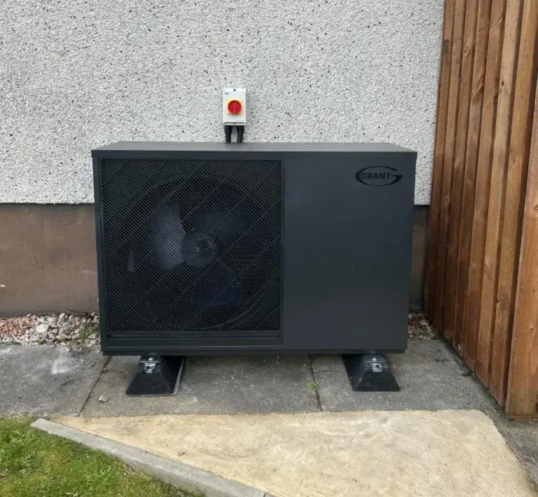 Grey heat pump installed outdoors