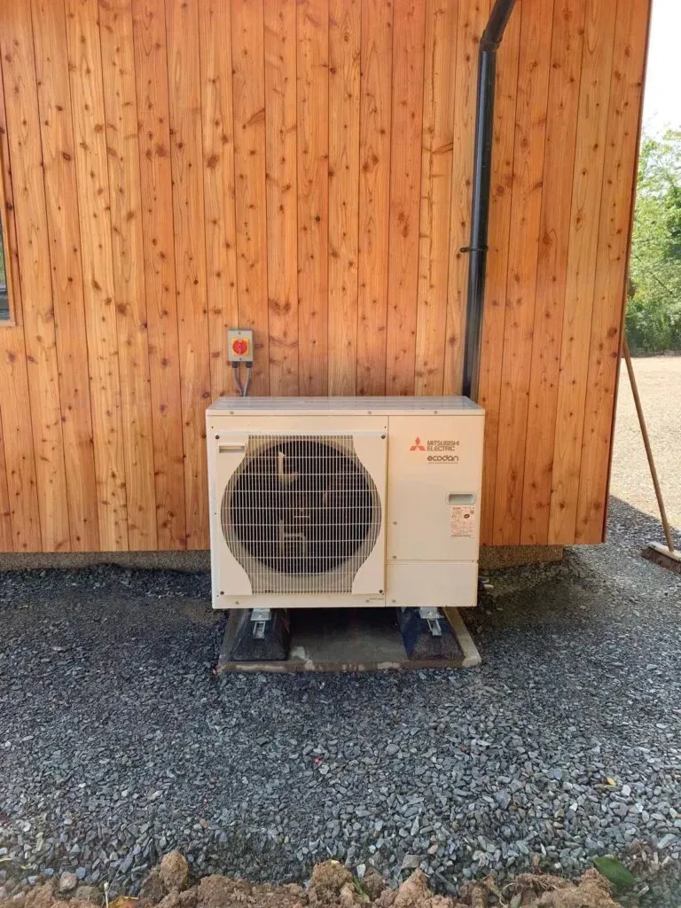 Wooden wall with outdoor heat pump
