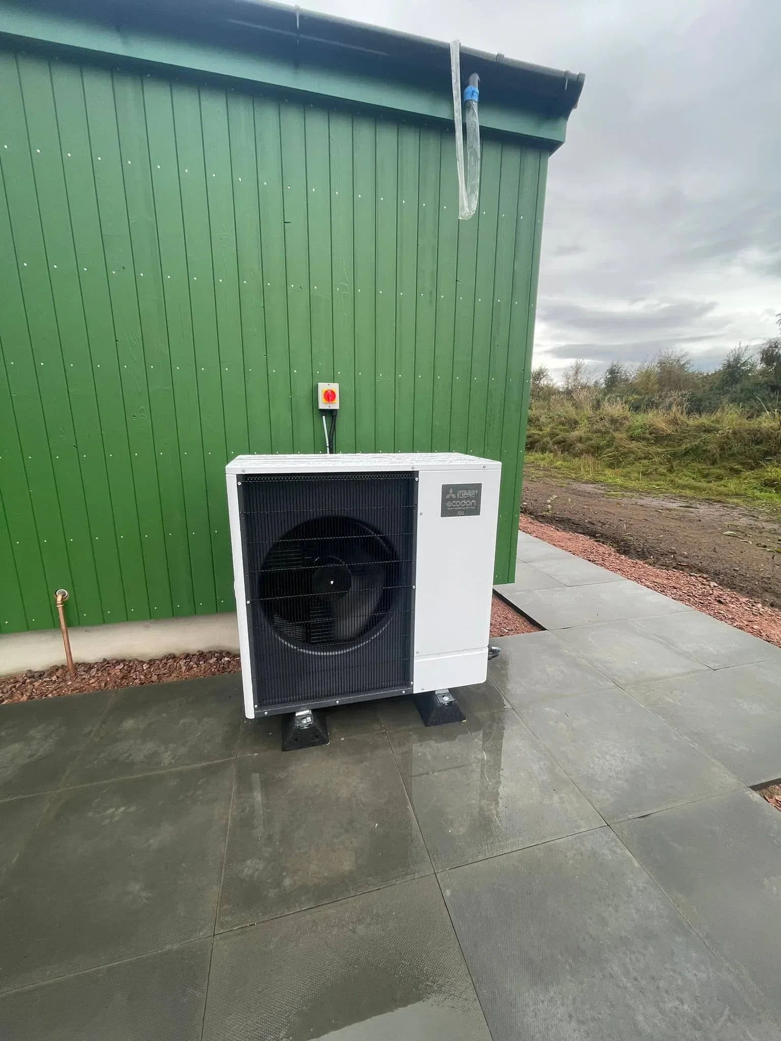Outdoor air source heat pump on patio