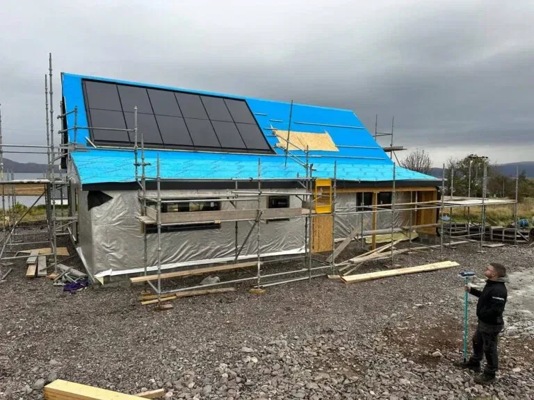 House under construction with solar panels